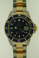 www.ebuy.dk pr�senterer: Rolex Submariner, herrearmb�ndsur, l�nke i 18 kt. guld og st�l, krans og krone i 18 kt. ...