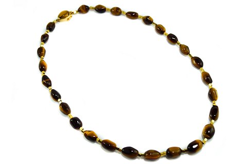 Karan Strand; A necklace in 18k gold with tiger-eye