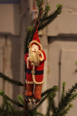 Old Christmas tree decoration in the shape of Santa Claus in fabric and cotton 
wool...