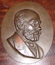 Johannes Hansen Portræt i bronze fra L. Rasmussens Bronzestøberi. Måler 23,6cm x 19cm og er i ...