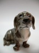 Dahl-Jensen figur nr. 1340 gravhund i l. sortering. Længde ca. 13 cm og højde ca. 10 cm. Vare ...