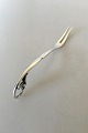 Georg Jensen Sølv pålægsgaffel #21 fra 1931. Måler 13,5cm og er i perfekt stand.
