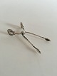 Georg Jensen Magnolia Sterling Sølv Sukkertang. Måler 10,5cm og er i perfekt stand.