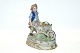 Figur af dreng med grøntsager i trillebør.Højde 16 cm. Længde 14 cm.Flot og Velholdt ...