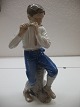 En Bing og Grøndahl figur nr. 1897 fløjtespilleren fremstillet af Ingeborg Plockross Irminger ...