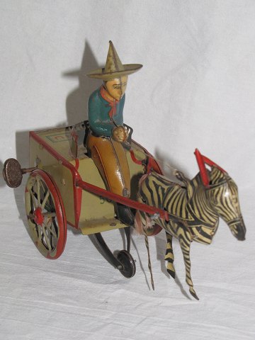 Tin toys
Carriage pulled by Zebra