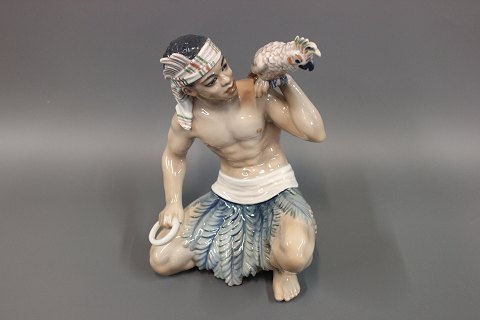 Oriental figurine by Dahl Jensen. No. 1305. Sudanese man with cockatoo. 5000 m2 
showroom.