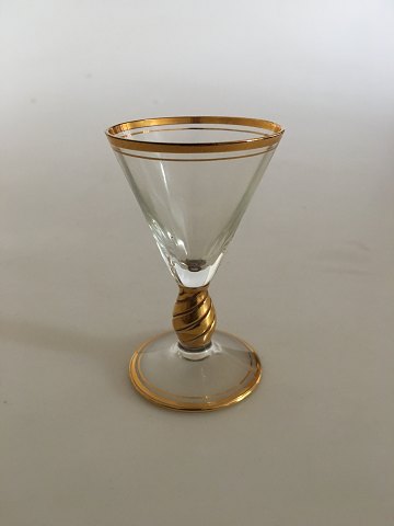 Holmegaard Ida snapsglas med guld på stilk, rand og fod. 