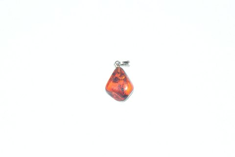 Elegant silver pendant with amber