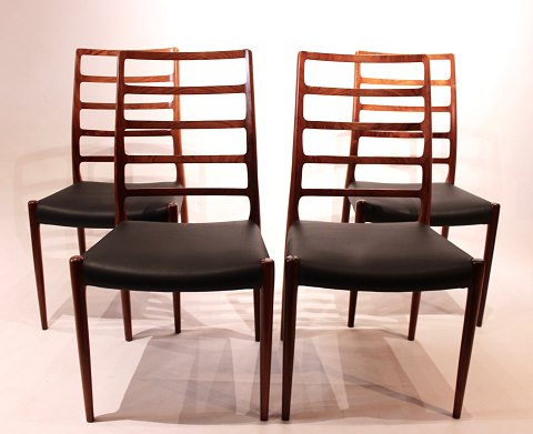 Set of four dining chairs, model 82, in rosewood and leather, by N.O. Møller.
5000m2 showroom.