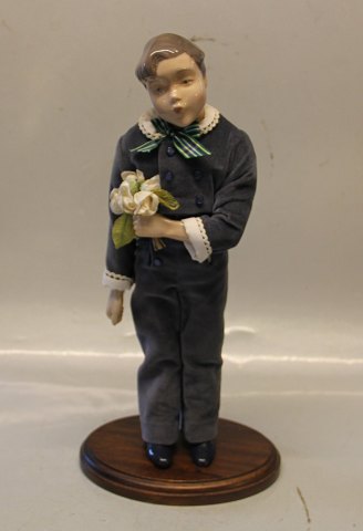 B&G Porcelain B&G 1986 Annual Doll "Hans"  38 cm on wooden stand Boy with 
flowers
