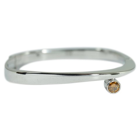 A small bangle set with fancy coloured diamond mounted in 14k white gold