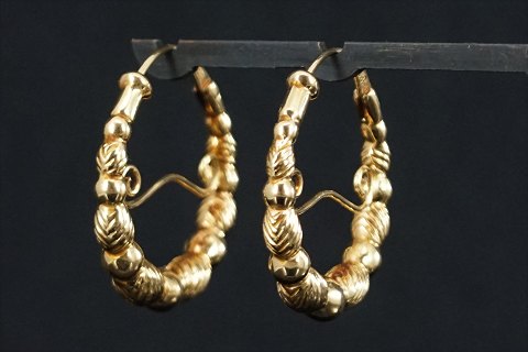 Store ørestikker/øreringe af massivt 14 kt. guld