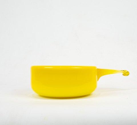 Yellow glass bowl with handle and white opaline glass on the inside from the 
Palet series by Michael Bang for Holmegaard.
