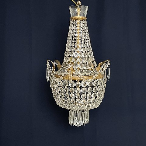 Fine dense chandelier with glass crown and garland
