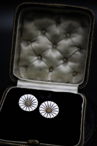 A pair of old Marguerit / Daisy earrings with clips in sterling silver and white 
enamel from A. Michaelsen...