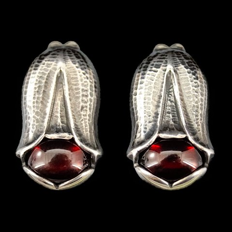 Georg Jensen; Heritage jewellery, 2007, earclips made of sterling silver set 
with a garnet