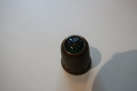 Old thimbles made of brassWith a greenflussDecoration in the brass as well