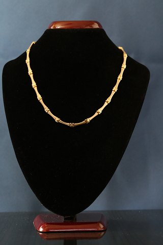 Beautiful gold chain in 14 carat gold, engraved BaG. Simple pattern and solid 
gold.