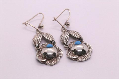 Earrings in silver, with pendant and inlaid turquoise.