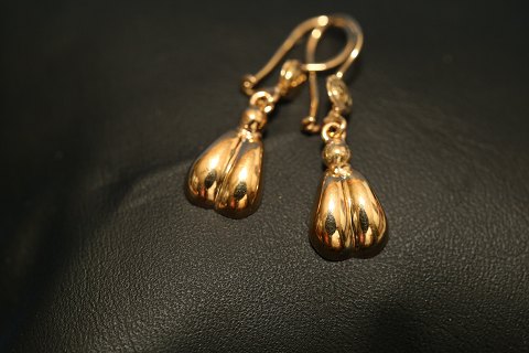 14 karat guld øreringe med runde former
