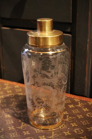 Cocktail shaker in glass with decorations with animals, ducks, flower motifs and 
brass top...