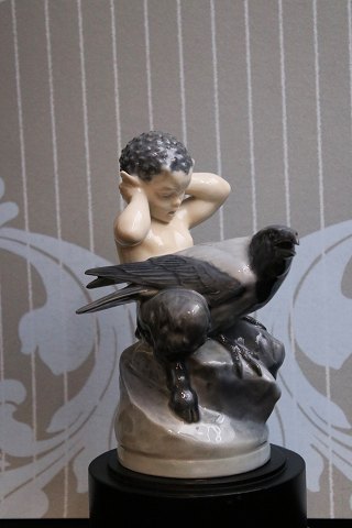 Royal Copenhagen porcelain figure of Faun and crow. 
RC#2113...