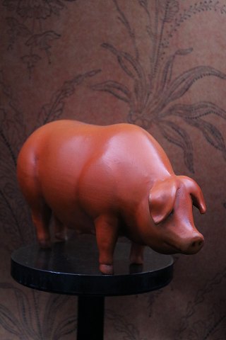 Decorative, old piggy bank in painted terracotta...
