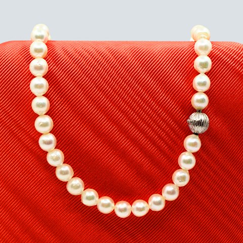 Ole Lynggaard; A pearl necklace with clasp in 14k white gold