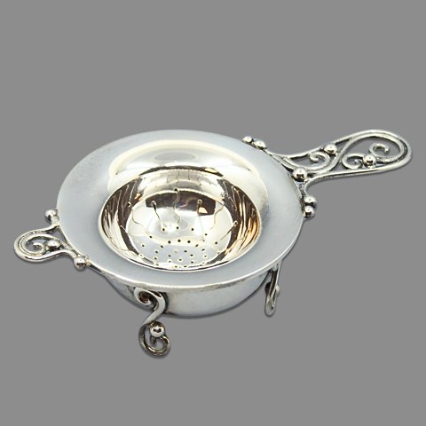 A Danish tea strainer of in sterling silver