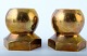 Gusum metal, a pair of candlesticks in brass. 
