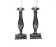 A pair of candle holders, tulip shaped