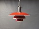PH3½-3 pendant with red lacquered metal Shades with a White edge and mounting in 
copper.
5000m2 showroom.