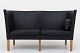Børge Mogensen / Fredericia Furniture
BM 2214 - Nybetrukket 2 pers. sofa i sort Savanne-læder og ben i eg. KLASSIK 
tilbyder polstring af sofaen med stof eller læder efter eget ønske.
Leveringstid: 6-8 uger
