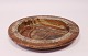 Brown stoneware dish with a light glaze by Azella Design.
5000m2 showroom.