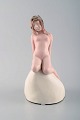 Vicken von Post for Rörstrand, Rare art deco figure in porcelain. Young nude 
woman on stone.