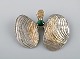 Swedish modernist brooch in silver with green agate, partially gilded. 1968.

