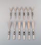 Georg Jensen. Cutlery, Scroll No. 22, Complete Fish Service of Hammered Sterling 
Silver.