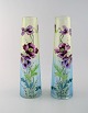 A couple of Legras vases with hand painted enamel decoration. Purple flowers 
with gold border on green blue background. 1890