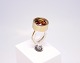 Ring of 14 ct. gold decorated with piece of amber.
5000m2 showroom.