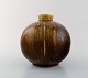 Early spherical shaped Saxbo vase of stoneware in modern design. Beautiful glaze 
in brown and yellow-green shades. Early 1930