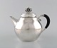 Rare Georg Jensen teapot in sterling silver with ebony handle. Dated 1915-30.
