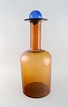 Otto Brauer for Holmegaard. Kolossal vase/flaske i brunt kunstglas med blue 
kugle. 1960