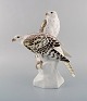 Meissen, Germany. Large figure with two falcons in hand-painted porcelain by 
design by Max Hermann Fritz, ca. 1908. Model number: 185.
