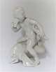 Bing & Grondahl. Porcelain figure. Kai Nielsen. Sea child on dolphin, blanc de 
chine. Height 18 cm. (1 quality)