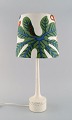 HANS-AGNE JAKOBSSON for A / B MARKARYD. Table lamp with colorful shade in fabric 
by Josef Frank. Mid 20th century.
