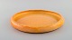 Svend Hammershøi for Kähler, HAK. Large round dish in glazed stoneware. 
Beautiful yellow uranium glaze. 1930s / 40s.
