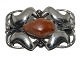 Henry Andersen 
Danish Art Nouveau silver brooch with  amber 1933-1950.