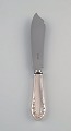 Early Georg Jensen Lily of the valley cake knife in silver (830) and stainless 
steel. Dated 1915-1930.
