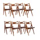 Hans J. Wegner, Denmark, set of eight Sawbuck Chairs CH 29, teak and leather. 
Signed Hans J. Wegner and Cark Hansen & Søn. Nice condition with signs of use. 
H: 75cm. H S: 44,5cm